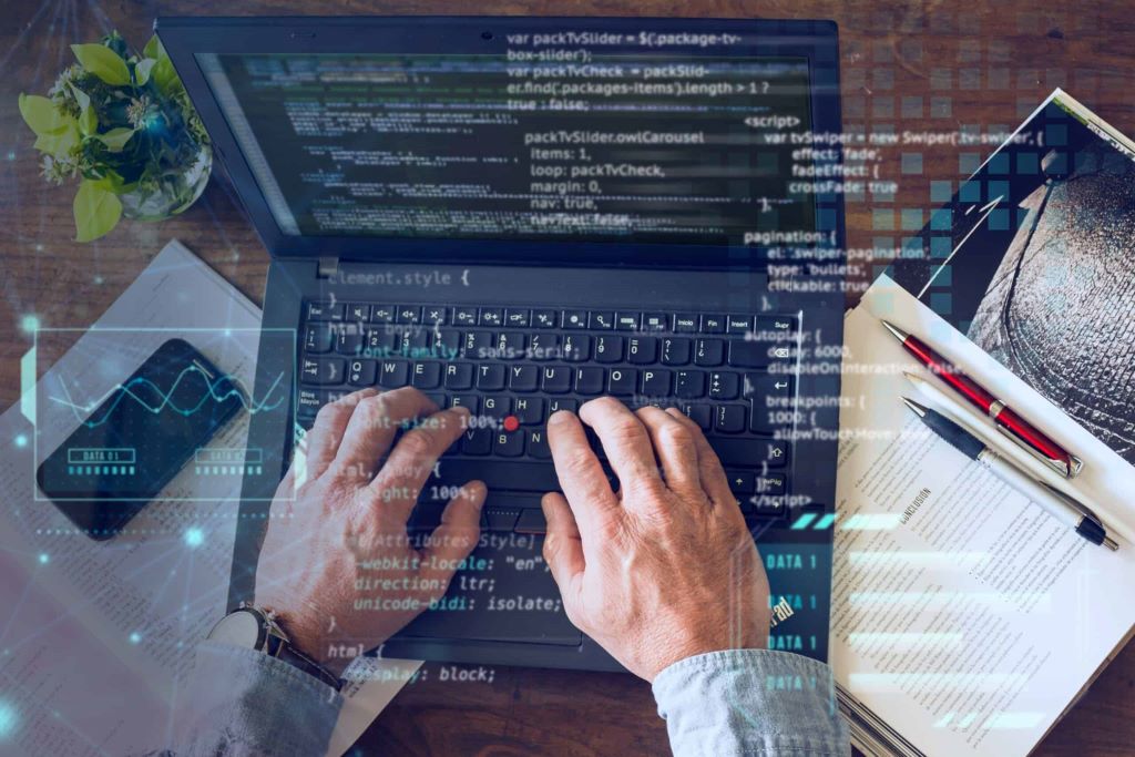 Software developers creating innovative business applications on computers in California
